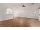 Bright and airy living room with tile floors, ceiling fan, and lots of natural light at 8549 W El Caminito Dr, Peoria, AZ 85345