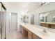 A bathroom vanity with dual sinks and a large mirror at 11260 N 92Nd St # 1080, Scottsdale, AZ 85260