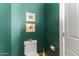 Powder room with green walls and white toilet at 14 E 14Th St, Tempe, AZ 85281