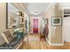 Bright entryway with hardwood floors, red door, and decorative console table at 14 E 14Th St, Tempe, AZ 85281