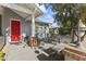 Red door entry with covered porch, seating, and landscaping at 14 E 14Th St, Tempe, AZ 85281