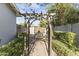 Pathway leading through a charming garden with arbor at 14 E 14Th St, Tempe, AZ 85281