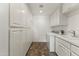 Laundry room with white cabinets and built-in washer and dryer at 14 E 14Th St, Tempe, AZ 85281