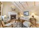 Cozy living room features a fireplace, vaulted ceiling and comfy seating at 14 E 14Th St, Tempe, AZ 85281