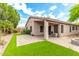 Home exterior with a covered patio, a charming fire pit, and desert-friendly landscaping perfect for outdoor enjoyment at 15912 W Marconi Ave, Surprise, AZ 85374