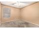 A carpeted bedroom includes a window and decorative border at 15912 W Marconi Ave, Surprise, AZ 85374