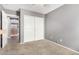 A bedroom has carpet, a double closet, and hall access at 15912 W Marconi Ave, Surprise, AZ 85374