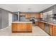 Bright kitchen with stainless steel appliances, oak cabinets, and kitchen island at 15912 W Marconi Ave, Surprise, AZ 85374