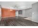 Spacious living room featuring hardwood floors, ceiling fan and lots of natural light at 15912 W Marconi Ave, Surprise, AZ 85374