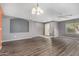 Living room with hardwood floors, recessed lighting and neutral color palette throughout at 15912 W Marconi Ave, Surprise, AZ 85374