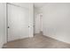 Bedroom featuring neutral carpet and closet with sliding doors at 17586 W Blue Sky Dr, Surprise, AZ 85387