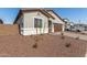 Charming single-story home with neutral stucco, brown tile roof, and desert landscaping at 17586 W Blue Sky Dr, Surprise, AZ 85387