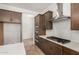 Modern kitchen featuring stainless steel appliances, including a gas cooktop and double ovens, complemented by white subway tiles at 17586 W Blue Sky Dr, Surprise, AZ 85387