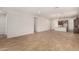 Spacious living room featuring tile floors, recessed lighting and an open layout that seamlessly connects to the modern kitchen at 17586 W Blue Sky Dr, Surprise, AZ 85387