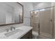 Sleek bathroom boasts double vanity, frameless shower, and modern fixtures at 21627 W Mariposa St, Buckeye, AZ 85396
