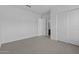 Spacious, well-lit bedroom features neutral decor, large windows, and a closet at 21627 W Mariposa St, Buckeye, AZ 85396