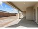 Covered patio with concrete flooring, ceiling light, and view of the backyard at 21627 W Mariposa St, Buckeye, AZ 85396