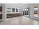 Spacious dining area with built-in cabinets, countertops, and sliding door access to the outdoors at 21627 W Mariposa St, Buckeye, AZ 85396