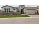 Beautiful single Gathering home with stone accents, manicured lawn, and welcoming curb appeal at 21627 W Mariposa St, Buckeye, AZ 85396