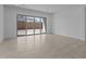 Bright living room with sliding glass doors that provide natural light and patio access at 21627 W Mariposa St, Buckeye, AZ 85396