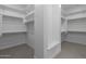 Well-organized walk-in closet with ample shelving and storage at 21627 W Mariposa St, Buckeye, AZ 85396