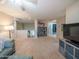 Spacious loft area with TV and built-in shelving at 23914 N 25Th Way, Phoenix, AZ 85024