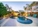 Inviting backyard pool with lounge chairs and landscape lighting at 23914 N 25Th Way, Phoenix, AZ 85024