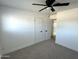 Bright bedroom with double closets and ceiling fan at 3733 W El Caminito Dr, Phoenix, AZ 85051