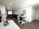 Bright dining area with dark wood table and chairs, adjacent to the kitchen at 3733 W El Caminito Dr, Phoenix, AZ 85051