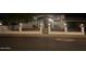 House exterior at night, featuring a white brick fence with black metal gate and lighting at 4315 E Nancy Ln, Phoenix, AZ 85042