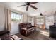 Relaxing Gathering room featuring leather sofas and large windows at 6255 E Ensenada St, Mesa, AZ 85205