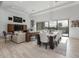 Elegant dining area with a large table and modern light fixture at 17213 E Morning Vista Ct, Rio Verde, AZ 85263