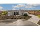 Modern home with stone exterior and circular driveway at 17213 E Morning Vista Ct, Rio Verde, AZ 85263