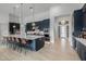 Modern kitchen with navy blue cabinets, a large island, and stainless steel appliances at 17213 E Morning Vista Ct, Rio Verde, AZ 85263