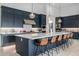 Modern kitchen with navy blue cabinets, white countertops, and a large island at 17213 E Morning Vista Ct, Rio Verde, AZ 85263