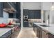 Modern kitchen with white quartz countertops and dark blue cabinetry at 17213 E Morning Vista Ct, Rio Verde, AZ 85263