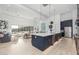 Modern kitchen with navy blue island and stainless steel appliances at 17213 E Morning Vista Ct, Rio Verde, AZ 85263