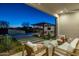 Outdoor patio furniture with views of the pool and outdoor kitchen at 17213 E Morning Vista Ct, Rio Verde, AZ 85263