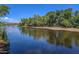 Serene riverfront view with lush vegetation at 17213 E Morning Vista Ct, Rio Verde, AZ 85263