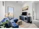 Relaxing sitting area with blue sectional and wet bar at 17213 E Morning Vista Ct, Rio Verde, AZ 85263