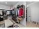 Bright walk-in closet with custom shelving and bench at 17213 E Morning Vista Ct, Rio Verde, AZ 85263