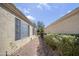 A beautiful exterior view shows a walkway along the side of the home at 17317 N Ponca Way, Surprise, AZ 85374