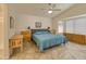 Spacious main bedroom with vaulted ceiling, tile floors, and a tranquil ambiance at 17317 N Ponca Way, Surprise, AZ 85374