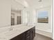 Main bathroom with double vanity, soaking tub and walk-in shower at 17709 W Southgate Ave, Goodyear, AZ 85338