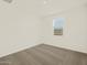 Bright bedroom featuring neutral carpet and window at 17709 W Southgate Ave, Goodyear, AZ 85338