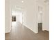 Bright hallway with tile flooring leading to other rooms at 17709 W Southgate Ave, Goodyear, AZ 85338