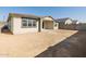 Back exterior view of house with covered patio at 17709 W Southgate Ave, Goodyear, AZ 85338