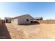 A view of the home's backyard and covered patio at 17868 W Blue Sky Dr, Surprise, AZ 85387