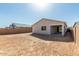 A view of the home's backyard and covered patio at 17868 W Blue Sky Dr, Surprise, AZ 85387