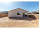 A view of the home's backyard and covered patio at 17868 W Blue Sky Dr, Surprise, AZ 85387